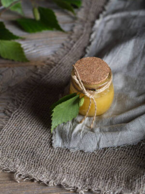 Honey with birch bark extract in a glass bottle. closeup
